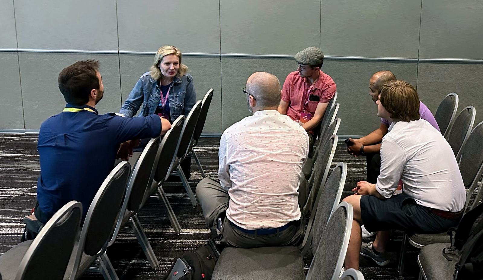 SciPy 2025 sprint participants working in small groups