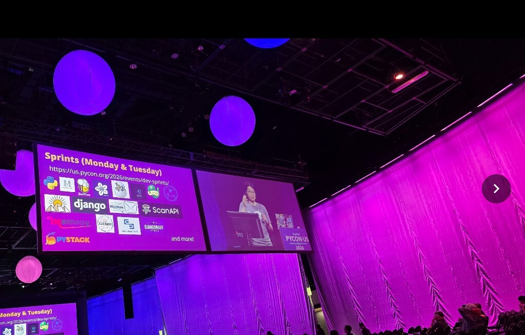 The PyCon US 2026 sprints slide projected on the main keynote screen, listing Monday and Tuesday sprint projects including Django, Mailman, ScanAPI, Memray, PyStack, Djangonaut Space, BeeWare, and more.